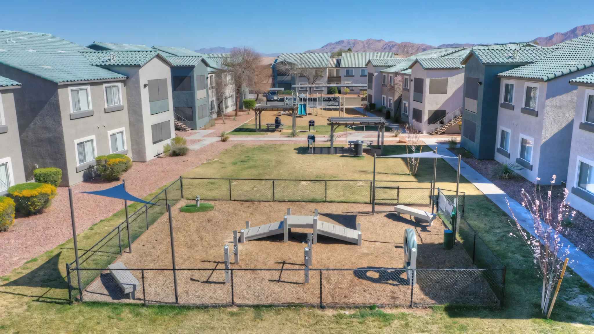 arial view of dog park bbq grills and benches and play area at Millennium East
