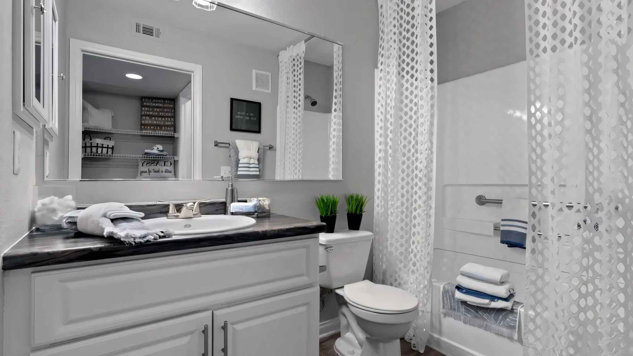 bathroom shower tub toilet sink with storage space at Millennium East