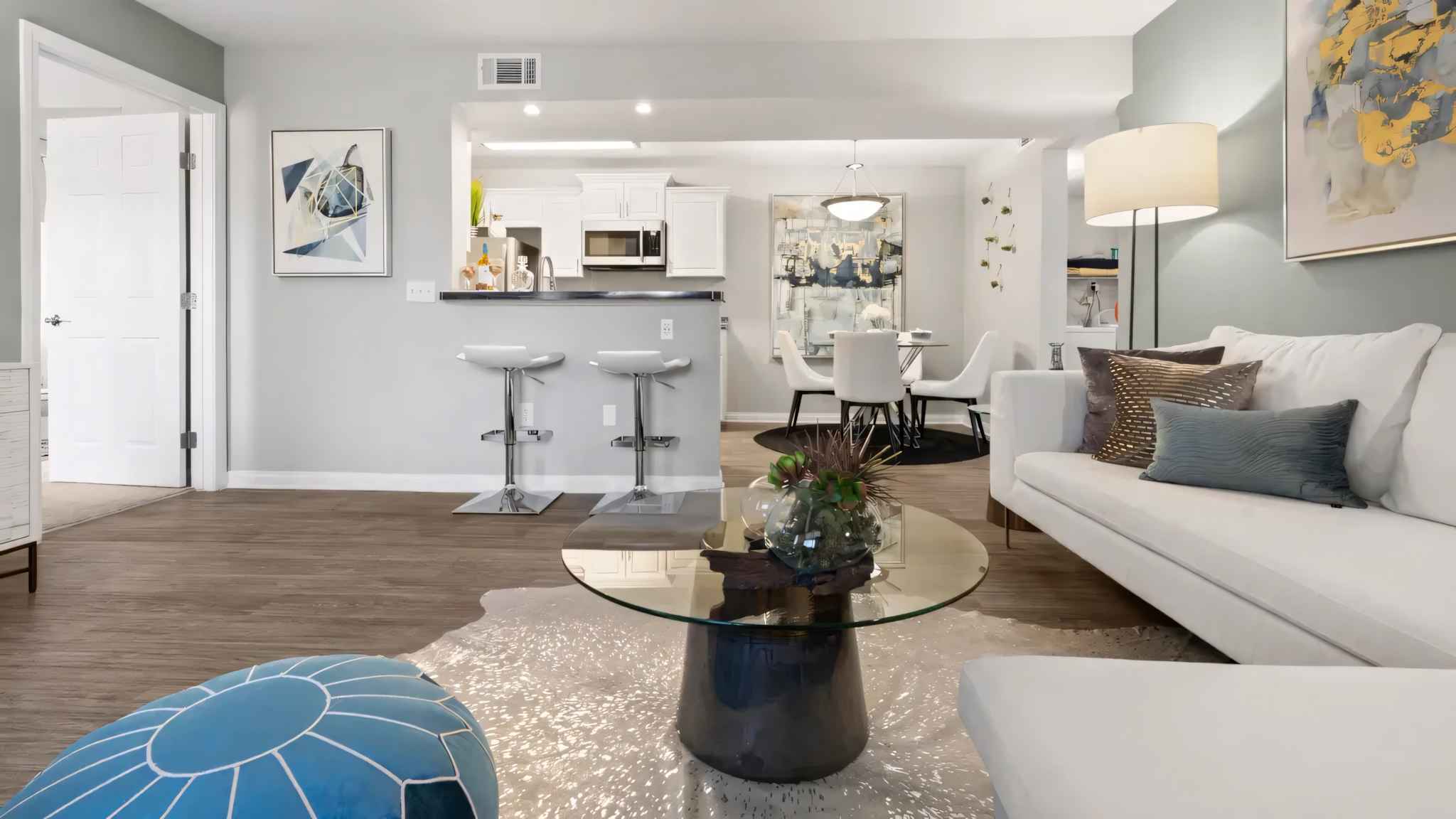 different living room angle showing into kitchen at Millennium East