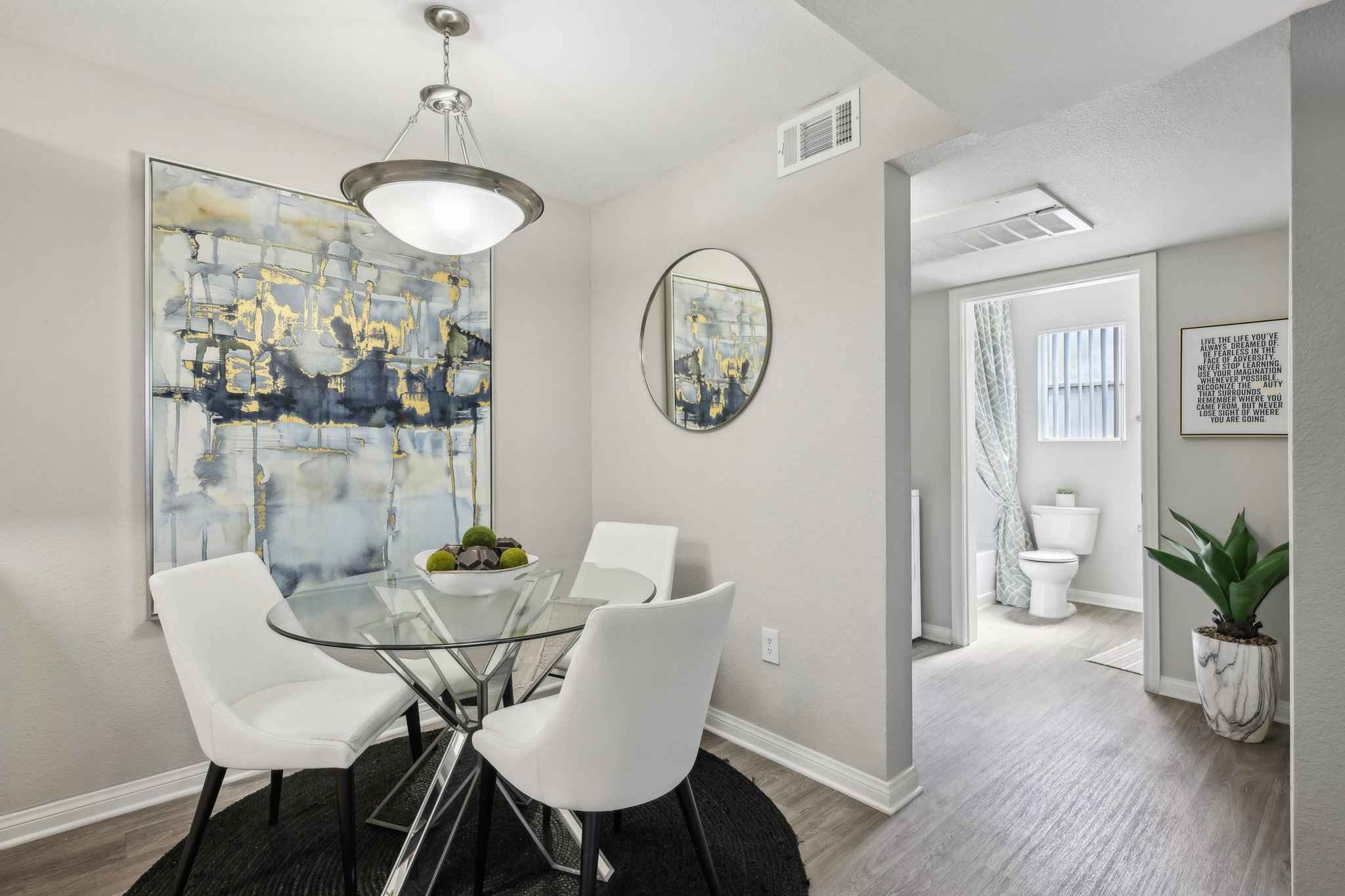 dining area with table showing hallway at Millennium East