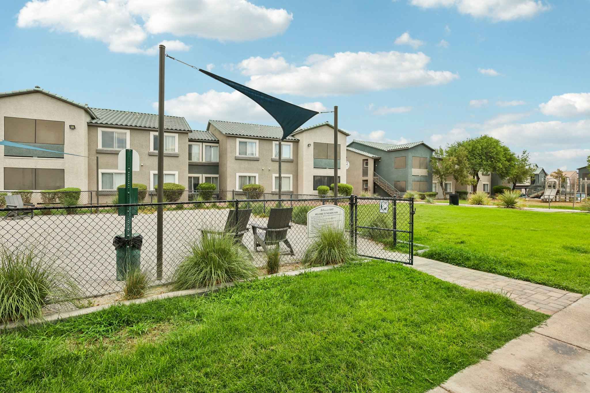 gated dog park entrance seating area at Millennium East