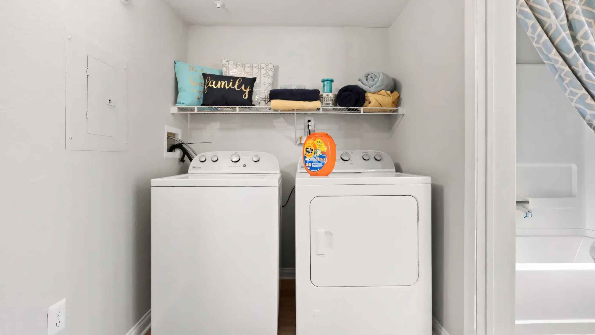 laundry room with washer and dryer at Millennium East