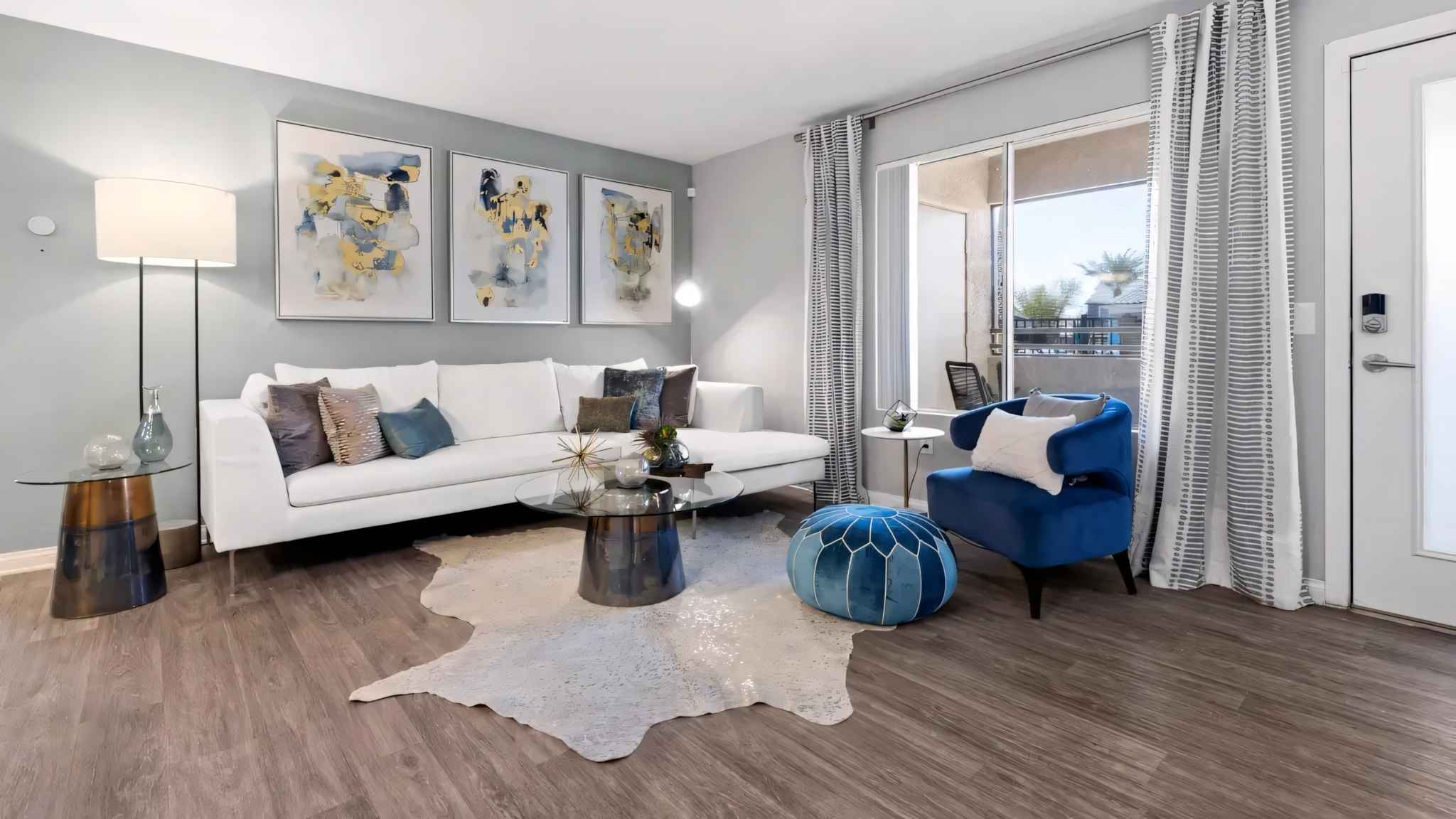 living room view couch coffee table and window showing outside view at Millennium East